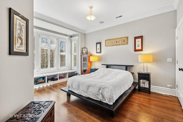 4752 N Beacon St, Chicago, IL 60613 - bedroom featuring ornamental molding, wood finished floors, and baseboards