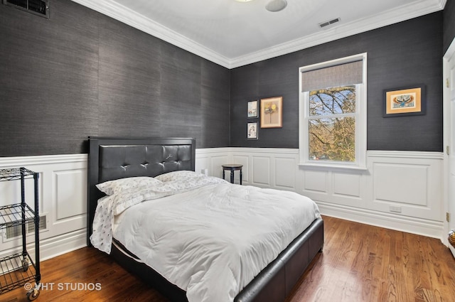 4752 N Beacon St, Chicago, IL 60613 - bedroom featuring wainscoting, wood finished floors, and crown molding