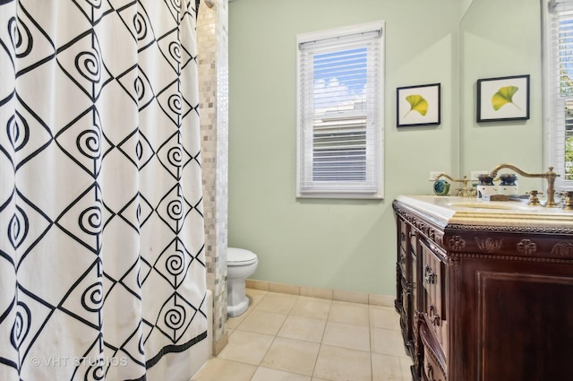 4752 N Beacon St, Chicago, IL 60613 - bathroom with toilet, vanity, baseboards, tile patterned flooring, and a shower with shower curtain