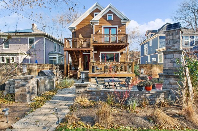 4752 N Beacon St, Chicago, IL 60613 - rear view of property featuring a deck, a fenced backyard, a patio, area for grilling, and a balcony
