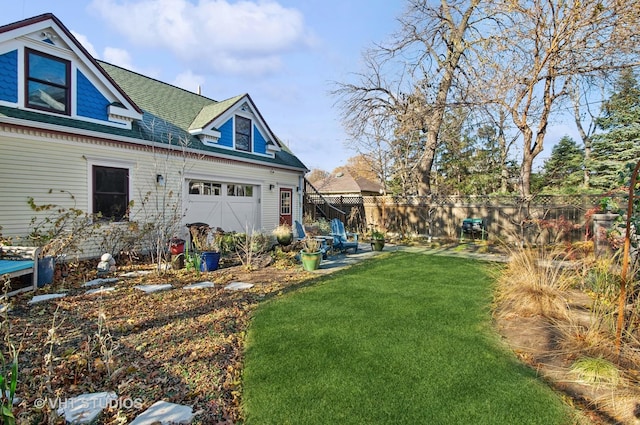 4752 N Beacon St, Chicago, IL 60613 - rear view of house featuring a shingled roof and a garage