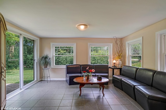 living room featuring baseboards and tile patterned floors