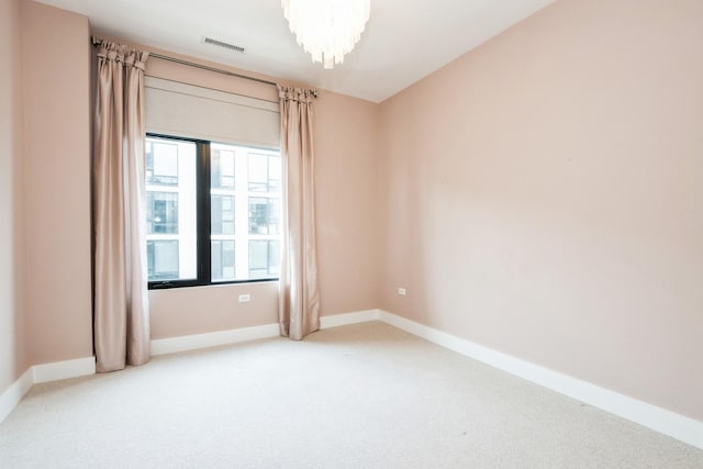 1701 W Webster Ave Unit 611, Chicago, IL 60614 - carpeted spare room featuring baseboards and a chandelier