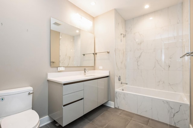 1701 W Webster Ave Unit 611, Chicago, IL 60614 - bathroom with vanity, toilet, a combined bath / shower with marble appearance, recessed lighting, and tile patterned flooring