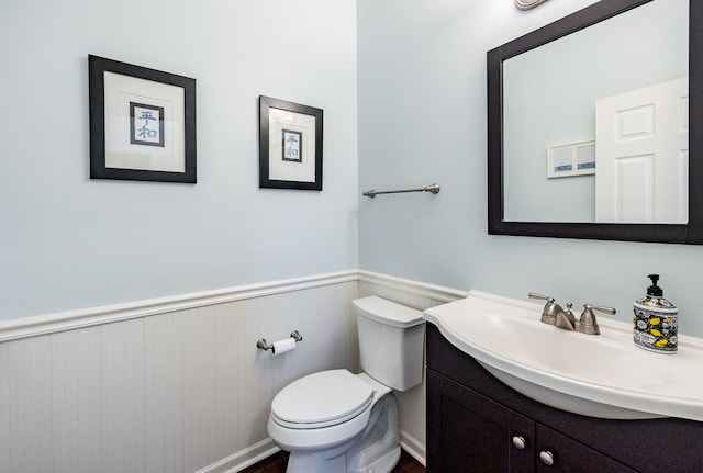3080 Wickenden Ave, Elgin, IL 60124 - bathroom with wainscoting, toilet, and vanity