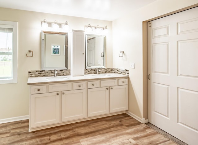 3080 Wickenden Ave, Elgin, IL 60124 - full bathroom with backsplash, wood finished floors, baseboards, and double vanity