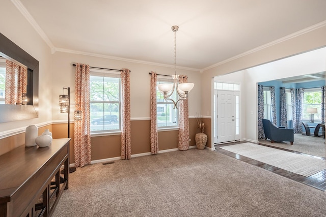 3080 Wickenden Ave, Elgin, IL 60124 - carpeted dining area featuring a chandelier, plenty of natural light, ornamental molding, and baseboards