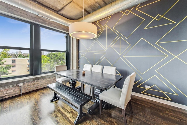 dining space featuring wood finished floors