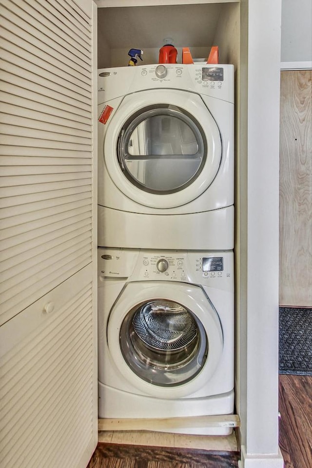 laundry room featuring stacked washer and clothes dryer