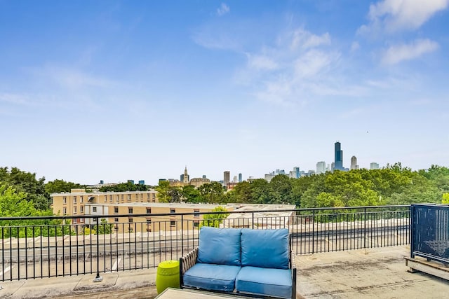 view of patio / terrace featuring a balcony and a skyline view