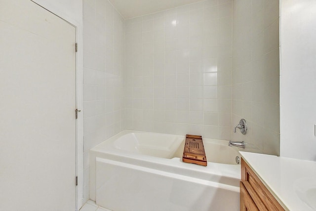 full bath with a tub and vanity