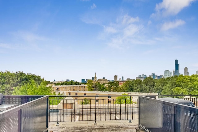 wooden deck with a skyline view