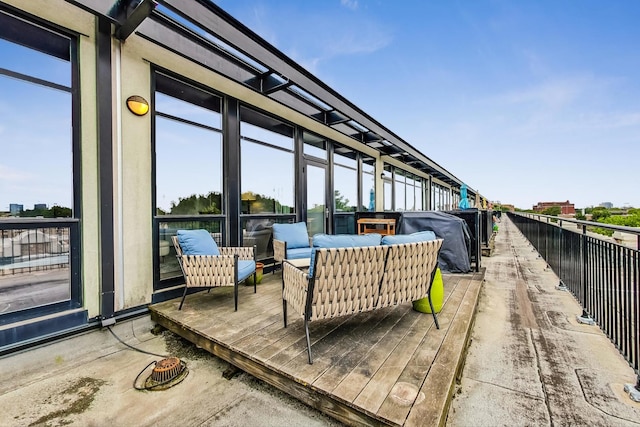 wooden deck featuring outdoor lounge area