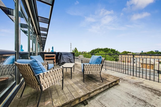 wooden terrace featuring an outdoor hangout area