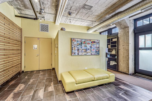 community lobby with a high ceiling
