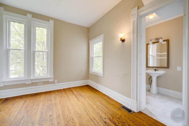 125 Arbor Ave, West Chicago, IL 60185 - unfurnished room with wood finished floors, baseboards, and a sink