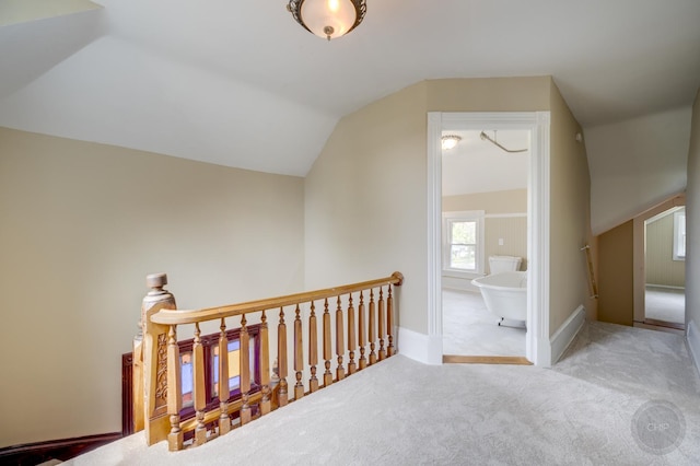 125 Arbor Ave, West Chicago, IL 60185 - corridor featuring an upstairs landing, carpet flooring, vaulted ceiling, and baseboards