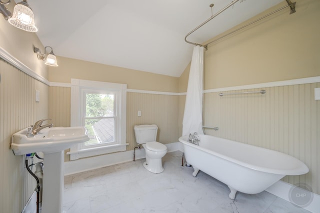 125 Arbor Ave, West Chicago, IL 60185 - full bathroom with a soaking tub, toilet, marble finish floors, and vaulted ceiling