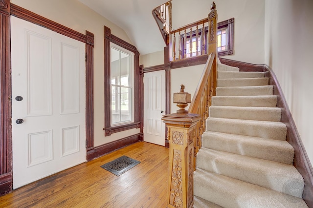 125 Arbor Ave, West Chicago, IL 60185 - foyer with stairs, wood finished floors, plenty of natural light, lofted ceiling, and baseboards