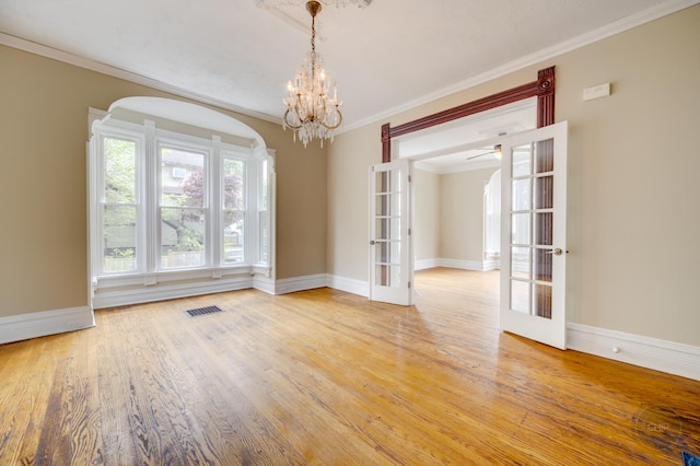 125 Arbor Ave, West Chicago, IL 60185 - empty room with wood finished floors, a chandelier, french doors, ornamental molding, and baseboards