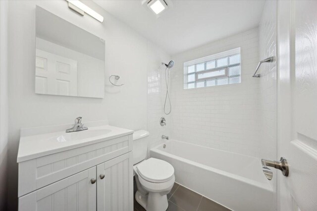 6357 W Addison St Unit Gse, Chicago, IL 60634 - full bath with toilet, vanity, shower / tub combination, and tile patterned floors