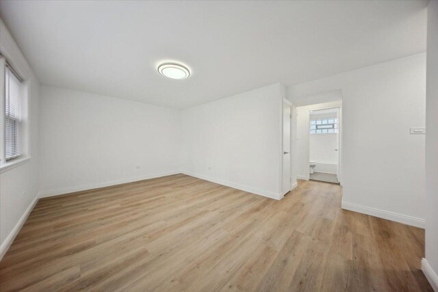 6357 W Addison St Unit Gse, Chicago, IL 60634 - spare room featuring light wood-style floors and baseboards