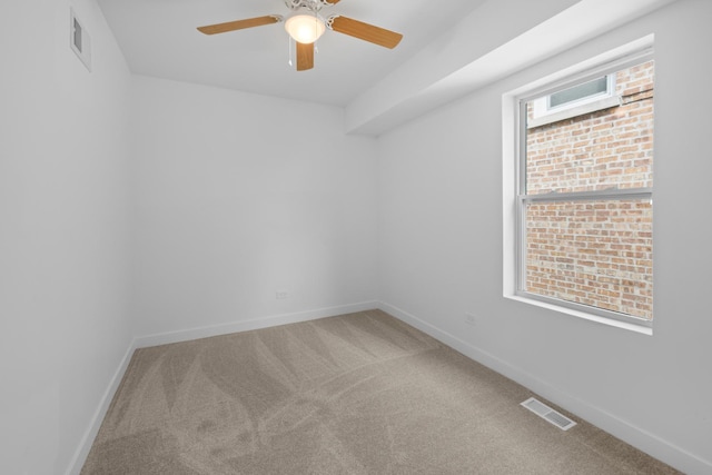 8317 S Constance Ave, Chicago, IL 60617 - spare room featuring carpet, a ceiling fan, and baseboards