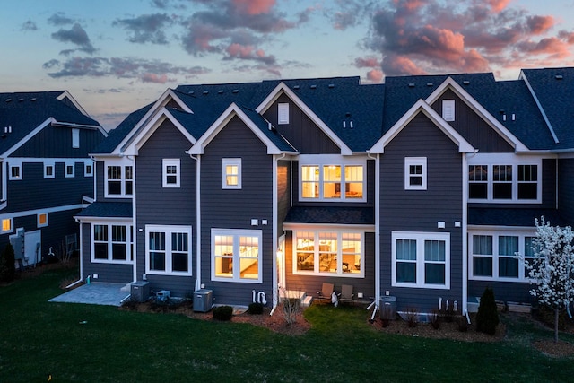 2234 Weatherbee Ln, Naperville, IL 60563 - rear view of house featuring a lawn, a patio, and board and batten siding