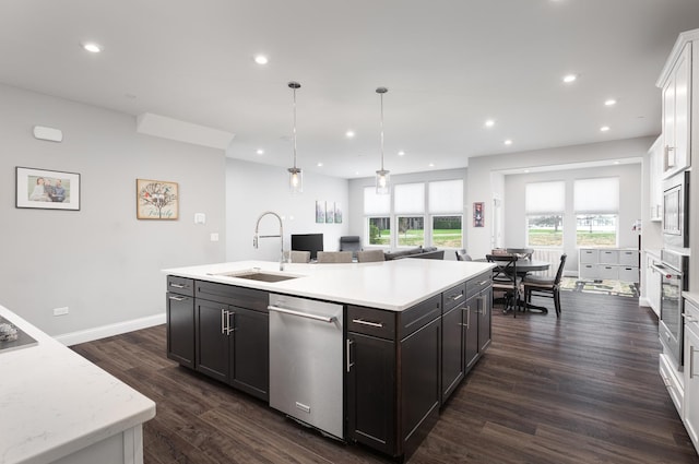 2234 Weatherbee Ln, Naperville, IL 60563 - kitchen featuring stainless steel appliances, dark wood-style flooring, a center island with sink, recessed lighting, and white cabinetry
