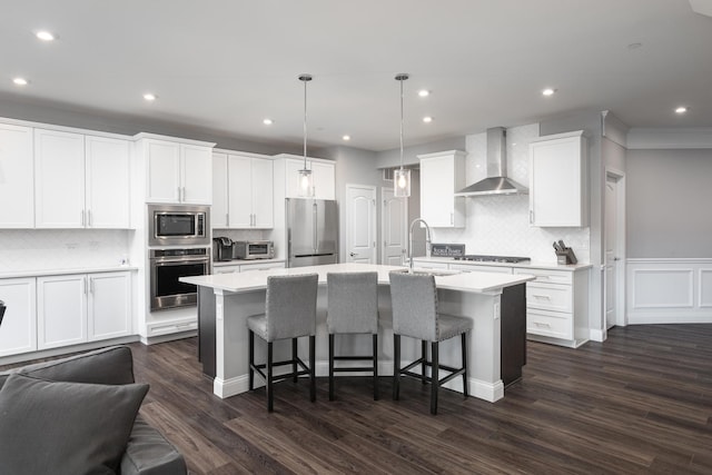 2234 Weatherbee Ln, Naperville, IL 60563 - kitchen with stainless steel appliances, wall chimney exhaust hood, tasteful backsplash, a breakfast bar, and light countertops