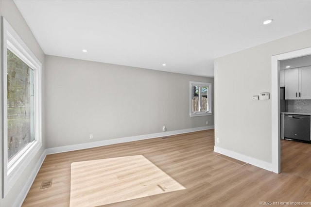 266 Merrill Ave, Calumet City, IL 60409 - spare room with light wood finished floors, recessed lighting, and baseboards