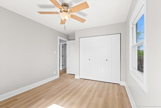 266 Merrill Ave, Calumet City, IL 60409 - unfurnished bedroom featuring light wood-style floors, baseboards, a closet, and ceiling fan