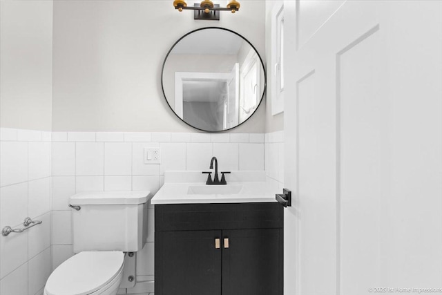 266 Merrill Ave, Calumet City, IL 60409 - half bath featuring toilet, vanity, tile walls, and wainscoting