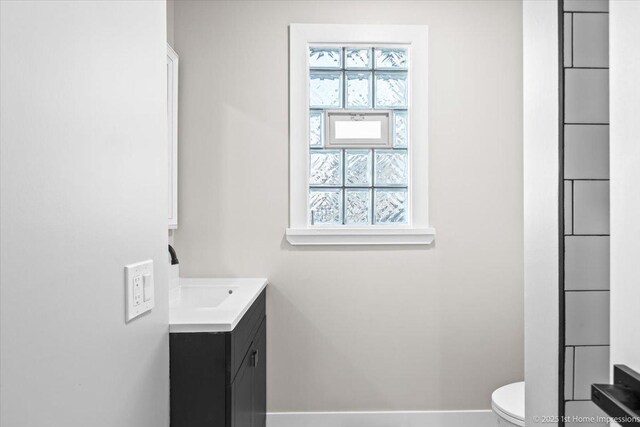 266 Merrill Ave, Calumet City, IL 60409 - bathroom with baseboards, toilet, and vanity