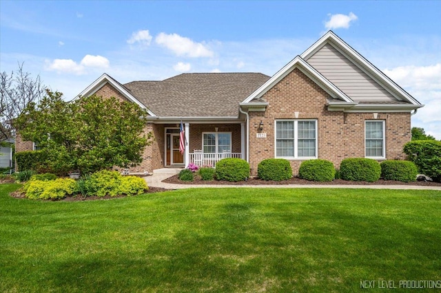 1123 Redbud Ln, Sugar Grove, IL 60554 - view of front of home with brick siding, a porch, and a front lawn