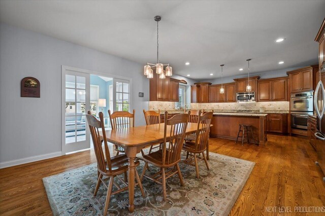 1123 Redbud Ln, Sugar Grove, IL 60554 - dining room with dark wood-style floors, recessed lighting, baseboards, and a chandelier