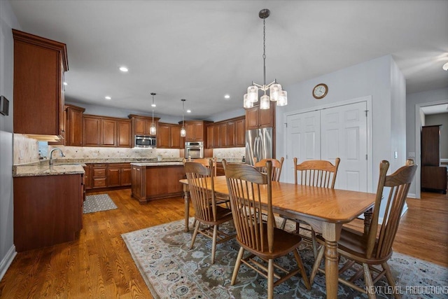 1123 Redbud Ln, Sugar Grove, IL 60554 - dining area with dark wood-type flooring, a chandelier, and recessed lighting