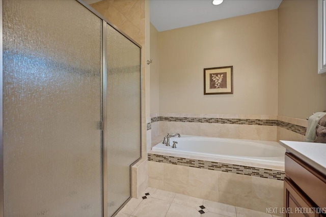 1123 Redbud Ln, Sugar Grove, IL 60554 - full bathroom with tile patterned flooring, vanity, a shower stall, and a garden tub