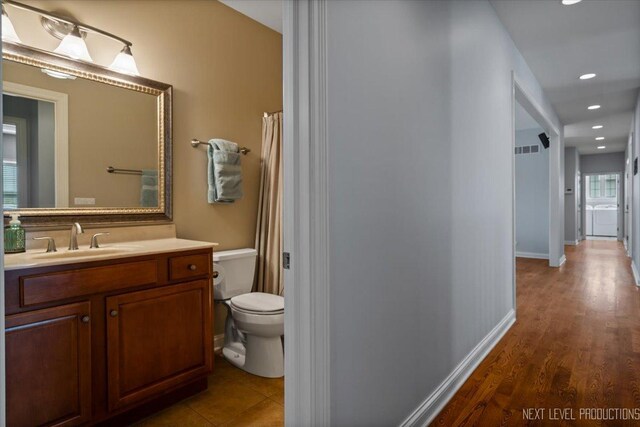 1123 Redbud Ln, Sugar Grove, IL 60554 - full bathroom featuring toilet, vanity, recessed lighting, wood finished floors, and baseboards