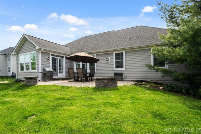 1123 Redbud Ln, Sugar Grove, IL 60554 - rear view of house with a patio area, a lawn, and a shingled roof