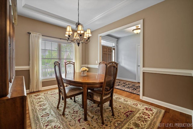 1123 Redbud Ln, Sugar Grove, IL 60554 - dining area with a chandelier, wood finished floors, and baseboards