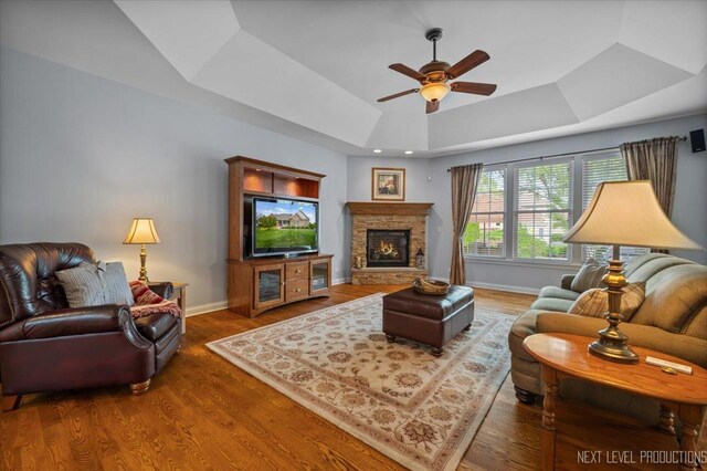 1123 Redbud Ln, Sugar Grove, IL 60554 - living area with a ceiling fan, baseboards, wood finished floors, and a stone fireplace