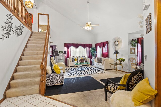 21220 Silktree Cir, Plainfield, IL 60544 - living area with high vaulted ceiling, stairway, ceiling fan, and tile patterned floors