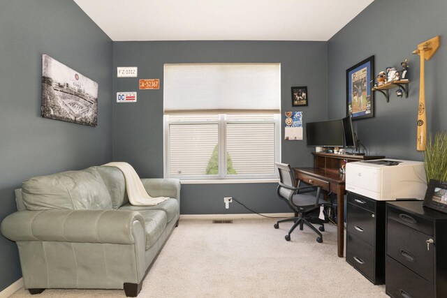office area with light carpet and baseboards