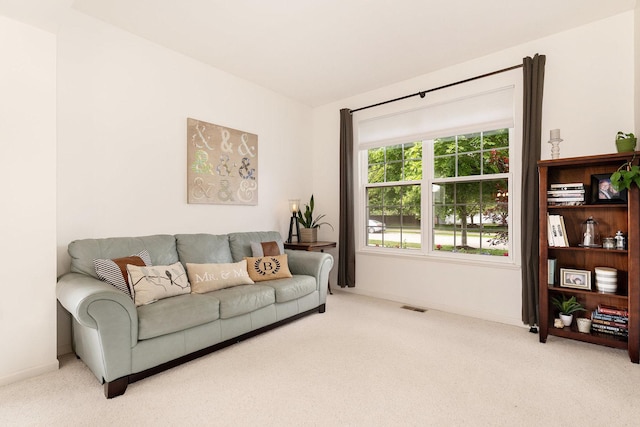 living room with carpet flooring and baseboards