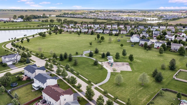 view of property location with a large body of water and nearby suburban area