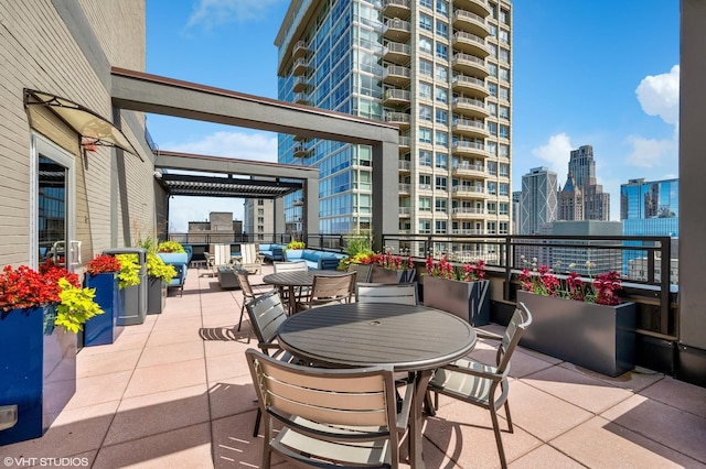 247 E Chestnut St Unit 1603, Chicago, IL 60611 - view of patio / terrace featuring a city view and outdoor dining area