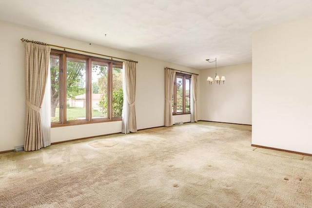 5718 Tasselbury Close, Rockford, IL 61114 - carpeted spare room featuring a chandelier and baseboards