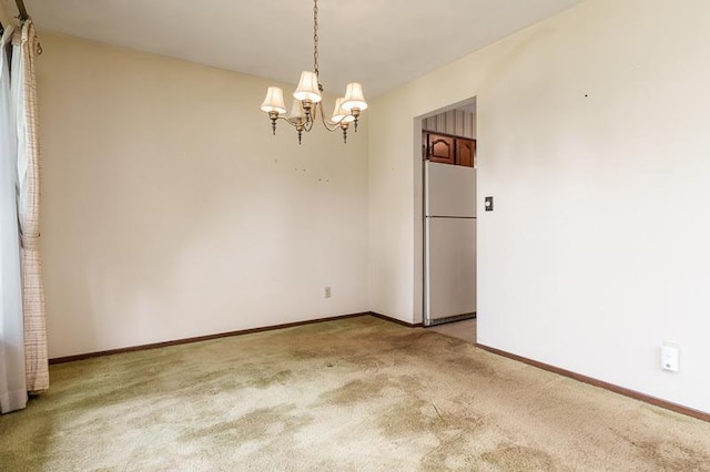 5718 Tasselbury Close, Rockford, IL 61114 - spare room with light carpet, a chandelier, and baseboards