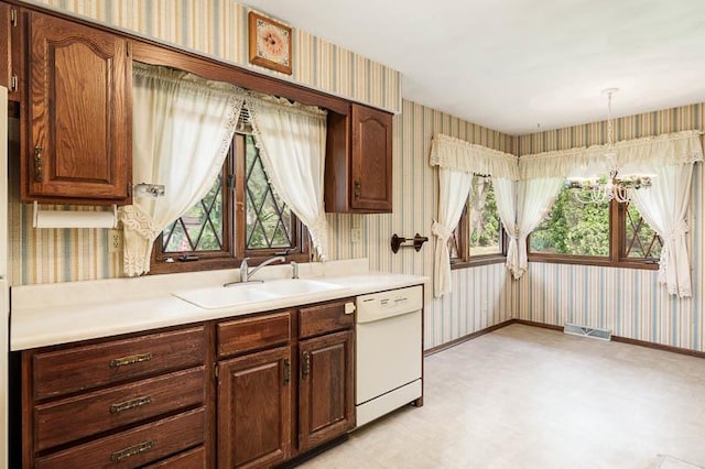 5718 Tasselbury Close, Rockford, IL 61114 - kitchen with wallpapered walls, dishwasher, light floors, a sink, and healthy amount of natural light